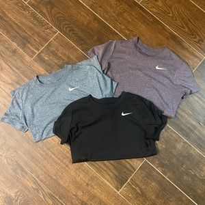 A bundle of THREE Nike Women’s Dri-Fit Tees, Sz M